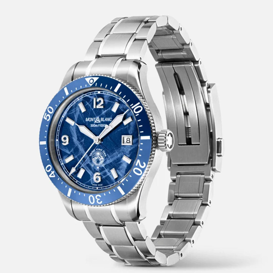 The Montblanc Iced Sea Automatic 41mm Watch adds elegance to the collection with its silver wristwatch design featuring a blue glacier pattern dial and bezel. The timepiece showcases bold white numerals and hour markers on an understated gray background, complemented by a polished metallic bracelet.