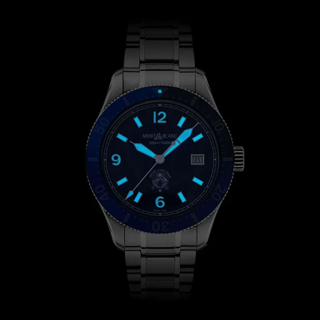 Introducing the Montblanc Iced Sea Automatic 41mm Watch, a sophisticated black timepiece featuring a unique glacier-patterned dial adorned with glowing blue numerals and hands. Designed for sports diving, it boasts water resistance up to 300 meters. The dark bezel and metal bracelet enhance its luminous display perfectly.