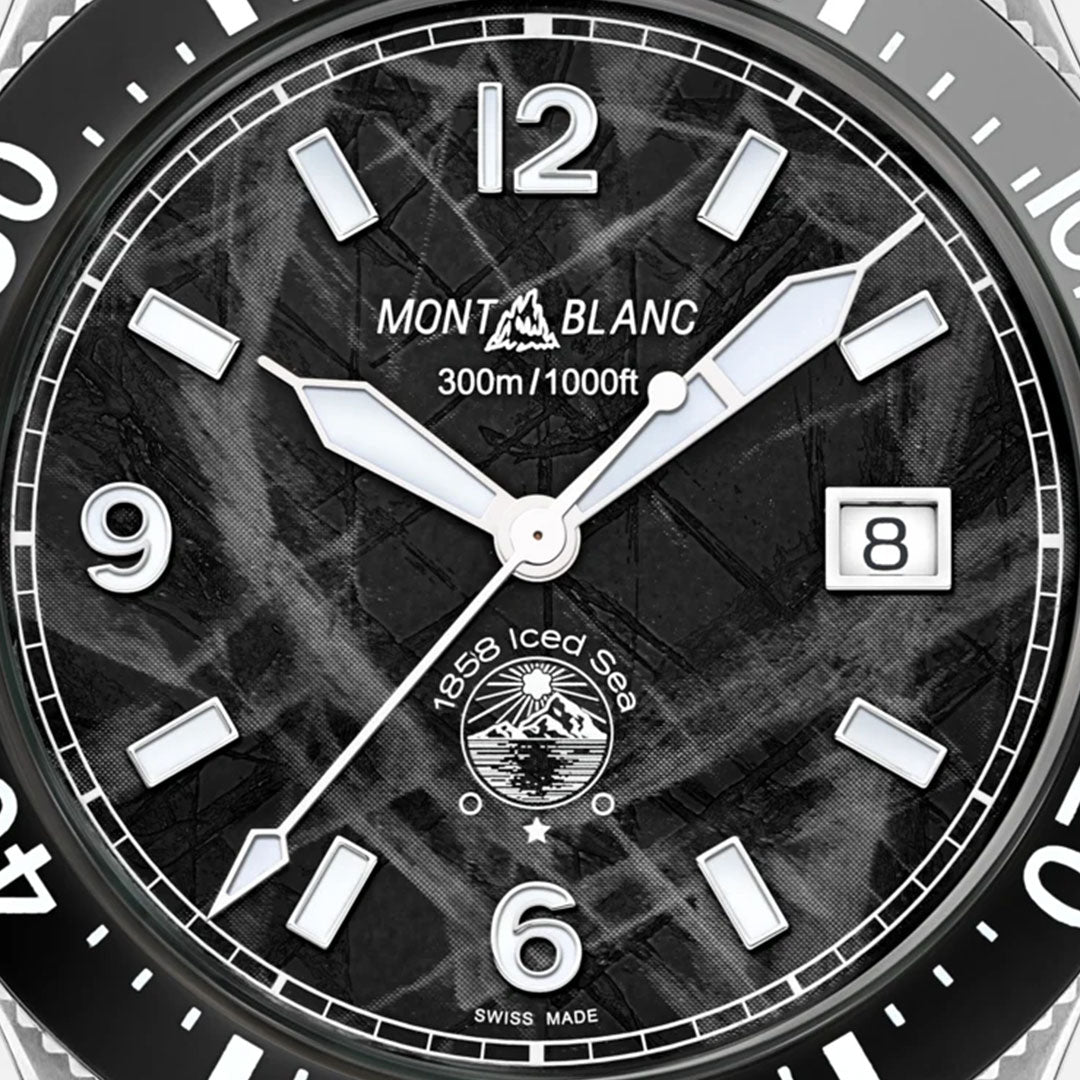 A detailed view of the Montblanc Iced Sea Automatic 41mm Watch highlights its glacier-patterned dial with white hour and minute hands. The watch is designed with prominent luminescent hour markers, a date window positioned at 3 o'clock, and "300m/1000ft" water resistance text, making it an ideal choice for anyone seeking an elegant sports diving watch.