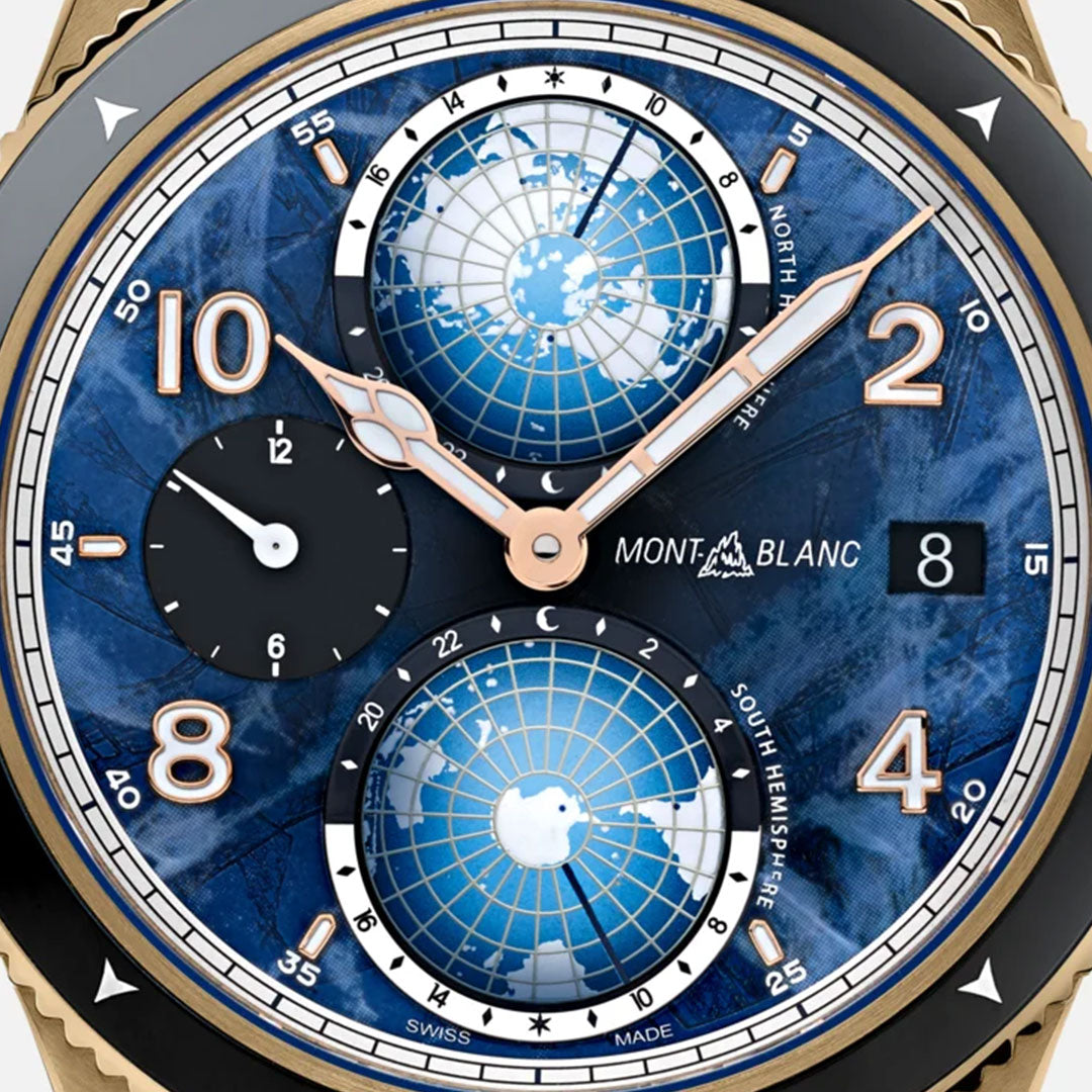 A detailed view of the Montblanc 1858 Geosphere 0 Oxygen The 8000 Automatic 42mm Watch Limited Edition highlights its striking blue dial, adorned with two globe designs, along with gold numerals and hands. This timepiece features an automatic movement with a date display and subdials, complemented by hour markers in gold. The watch's outer casing elegantly combines elements of gold and silver.