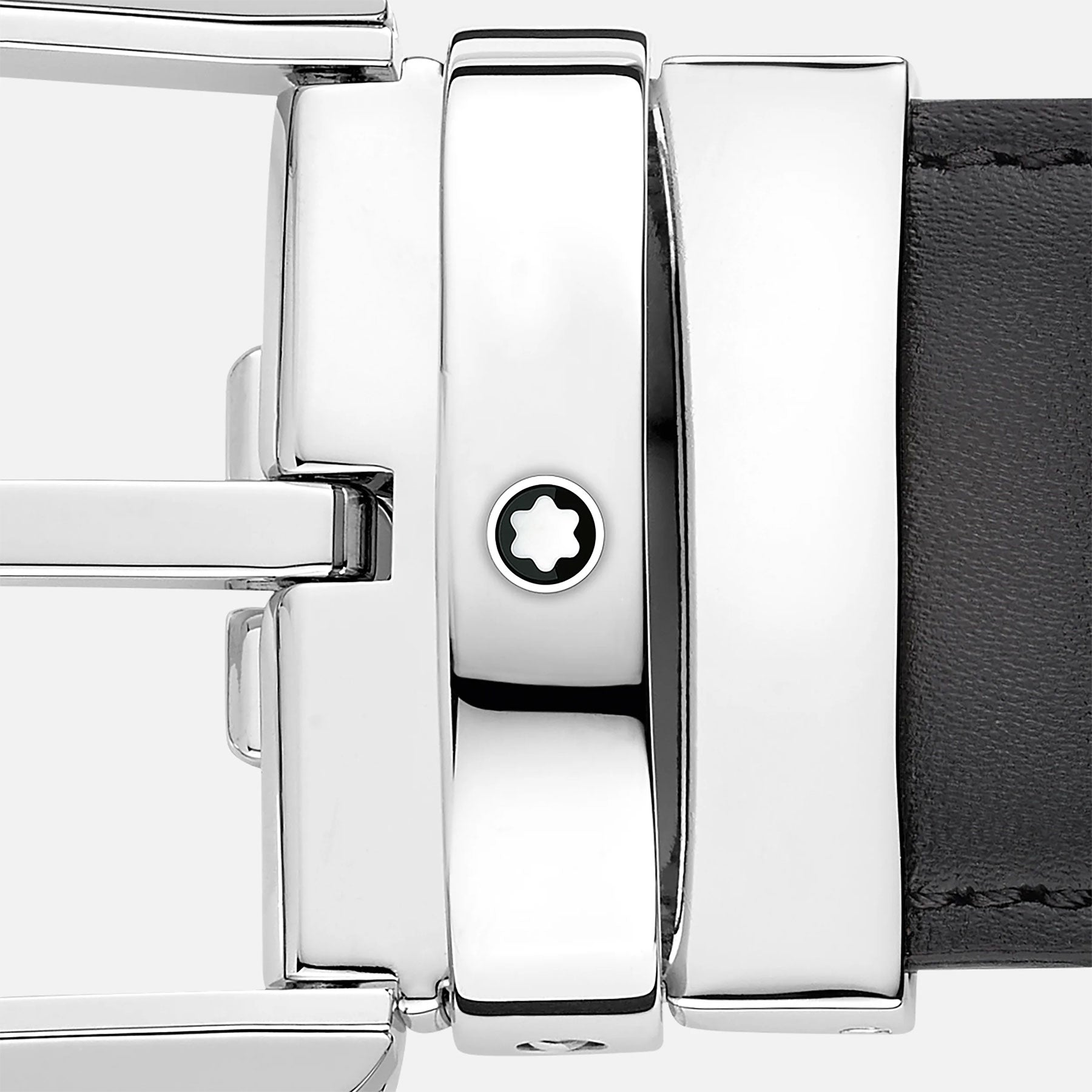 Close-up of the highly polished buckle on the Montblanc Horseshoe Leather Belt, featuring a small star emblem. The silver buckle, which reflects light beautifully, is attached to a sleek black strap.
