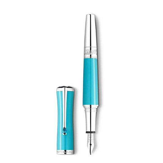 The Montblanc Muses Maria Callas Special Edition Fountain Pen, featuring a turquoise resin body with silver tip and cap accents, is displayed upright. The cap is placed next to the pen, highlighting Montblanc's logo at its base. The design radiates a sleek and elegant charm.