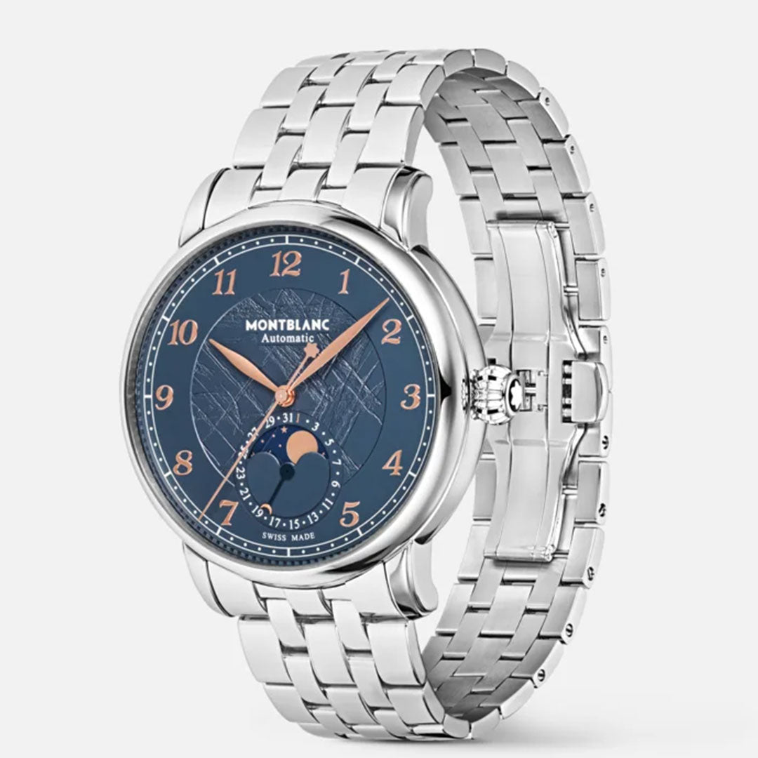 The elegant Montblanc Star Legacy Moonphase Automatic 42mm Watch Limited Edition boasts a silver metal strap and a refined round face. Its captivating glacier pattern dial features a dark blue background with rose gold-coated hands and numerals, exemplifying the renowned craftsmanship of Montblanc.