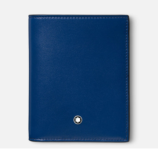 The Montblanc Meisterstuck Compact Leather Wallet 6cc is a sleek, compact wallet in a beautiful shade of blue, featuring a smooth texture and adorned with Montblanc's iconic small, round star-like emblem at the bottom center. Its elegance is further highlighted against a simple light gray background.