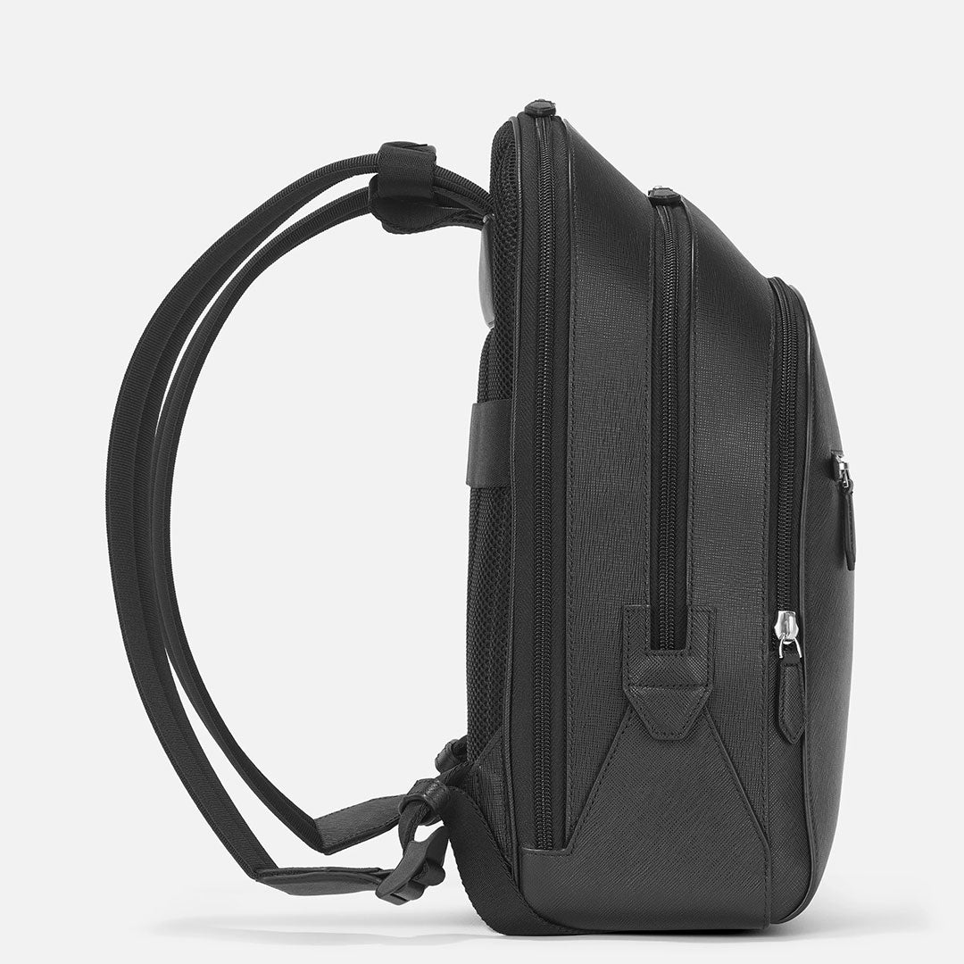 A side view of the Montblanc Sartorial Medium 3 Compartments Leather Backpack Bag in sleek black Saffiano leather with adjustable straps and a textured finish, showcased against a plain white background.