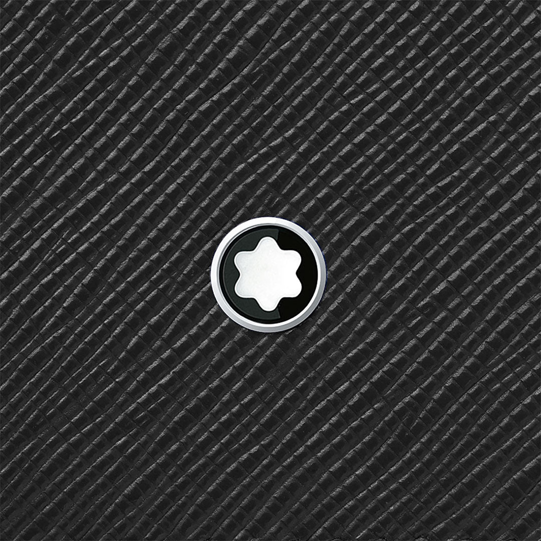 A white six-pointed star emblem in a black circle is centered on the textured black Saffiano leather of the Montblanc Sartorial 6cc Leather Wallet by Montblanc.