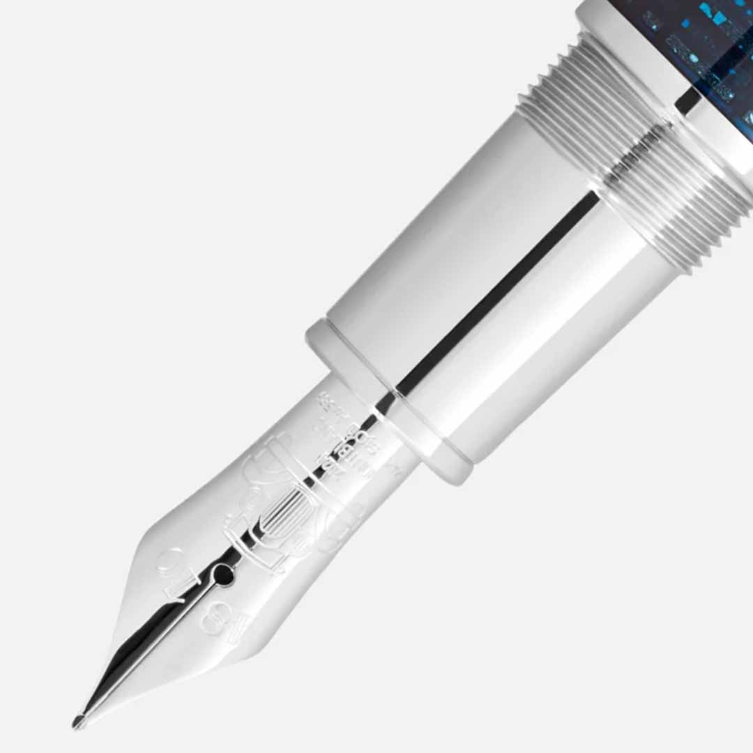 Close-up image of the Montblanc Great Characters Homage to The Great Gatsby Special Edition Fountain Pen's silver nib, featuring intricate engravings that evoke the opulence of the Jazz Age, attached to a pen barrel with a textured metallic finish. The background is a plain light gray.