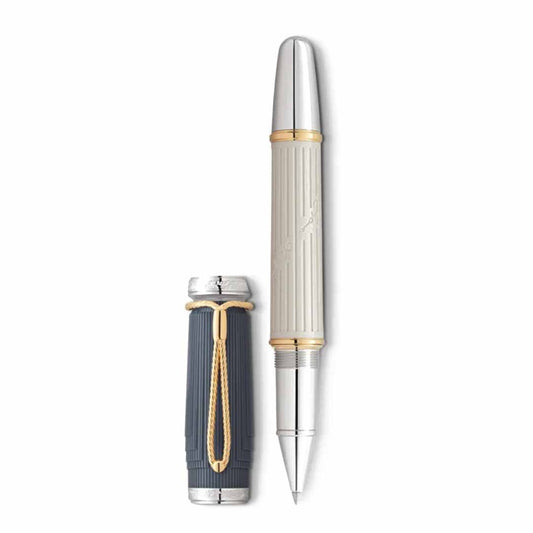 The Montblanc Writers Edition Homage to Jane Austen Limited Edition Rollerball Pen, a luxurious writing instrument with a silver and gold-toned finish inspired by the Regency era, is showcased with its cap removed and placed beside it. The pen's body displays ribbed detailing along with elegant gold accents, while the cap boasts a distinctive gold clip characteristic of this homage to Jane Austen.