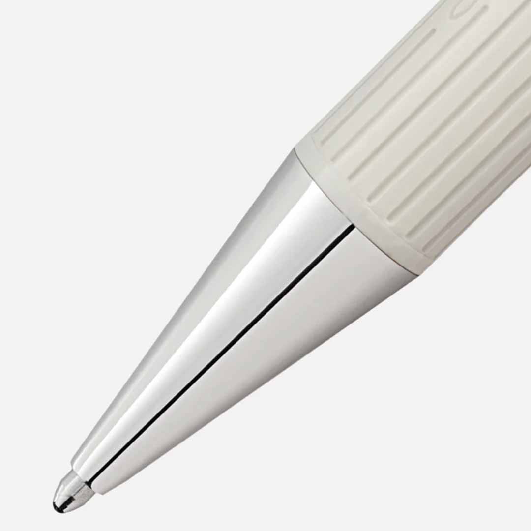 Close-up of the Montblanc Writers Edition Homage to Jane Austen Limited Edition Ballpoint Pen tip against a plain background. This pen boasts a sleek, metallic finish and a textured grip, reminiscent of the elegance found in Jane Austen's Regency era.