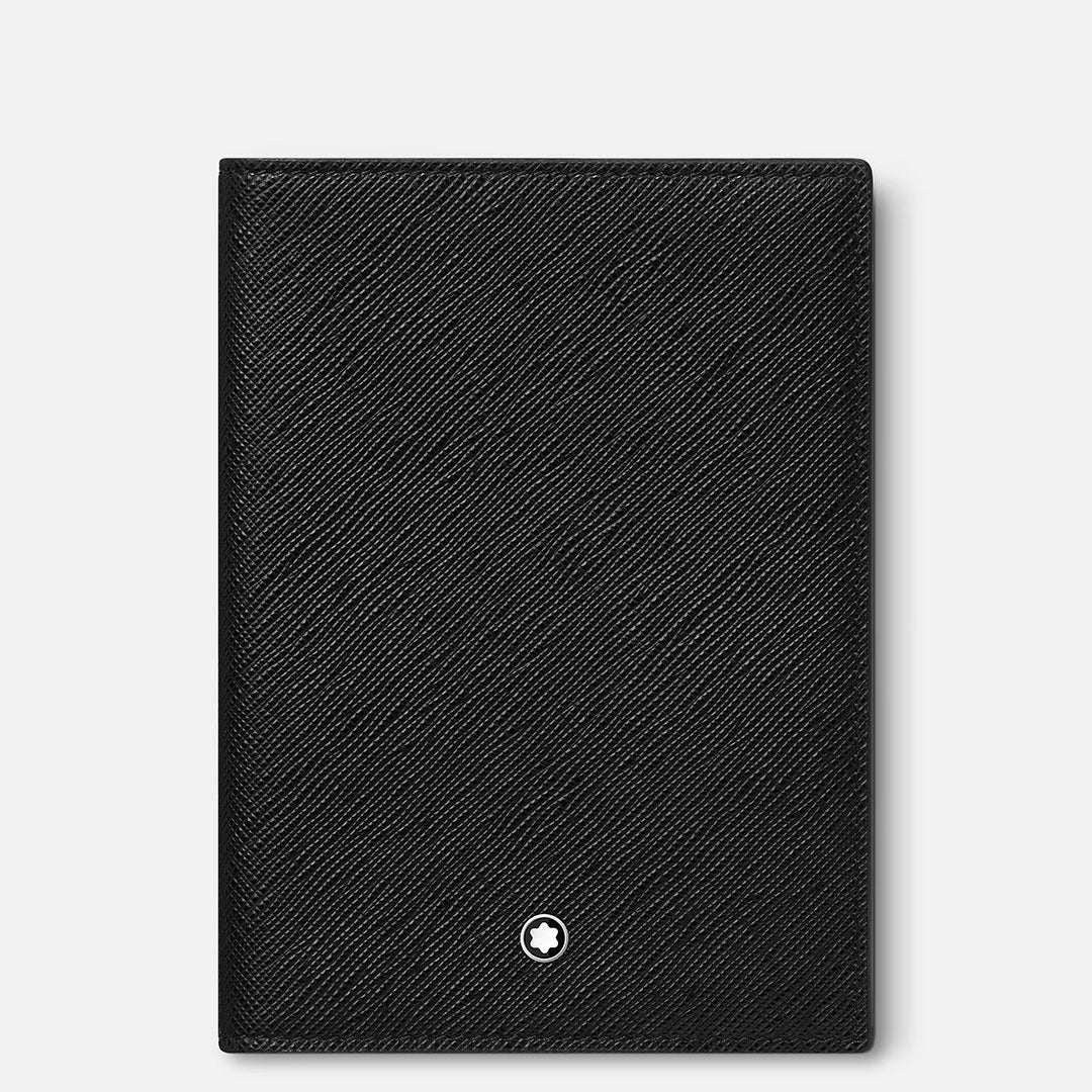 The Montblanc Sartorial Leather Passport Holder, crafted in black saffiano leather with a small white circular Montblanc emblem at the bottom center, is an elegant travel accessory for frequent flyers.