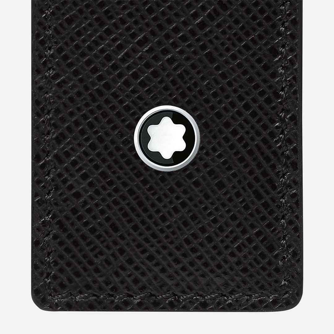 Close-up of the Montblanc Sartorial 1-Pen Leather Pouch crafted from textured full-grain leather, highlighted by a round Montblanc emblem with a white star and detailed black stitching along the corner.