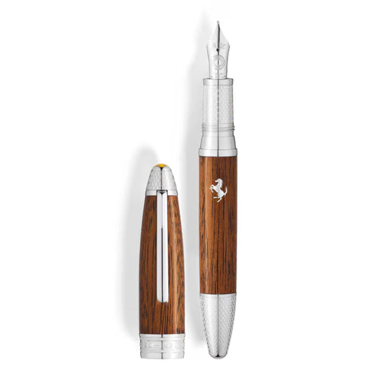 The Montblanc Meisterstück Great Masters Ferrari Tailor Made Classica Special Edition Fountain Pen features a woodgrain body, silver accents, and a silver emblem, with its cap upright beside the elegant uncapped pen.