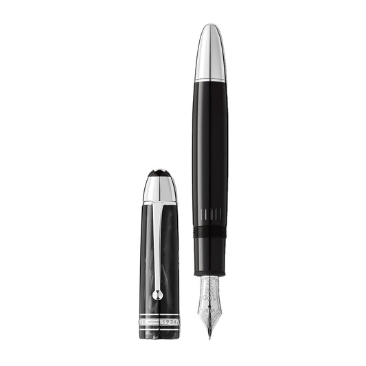 The Montblanc Meisterstuck The Original Collection 149 Fountain Pen M is pictured in black with a silver nib and cap beside it, featuring glossy black and silver accents with intricate detailing on the nib.