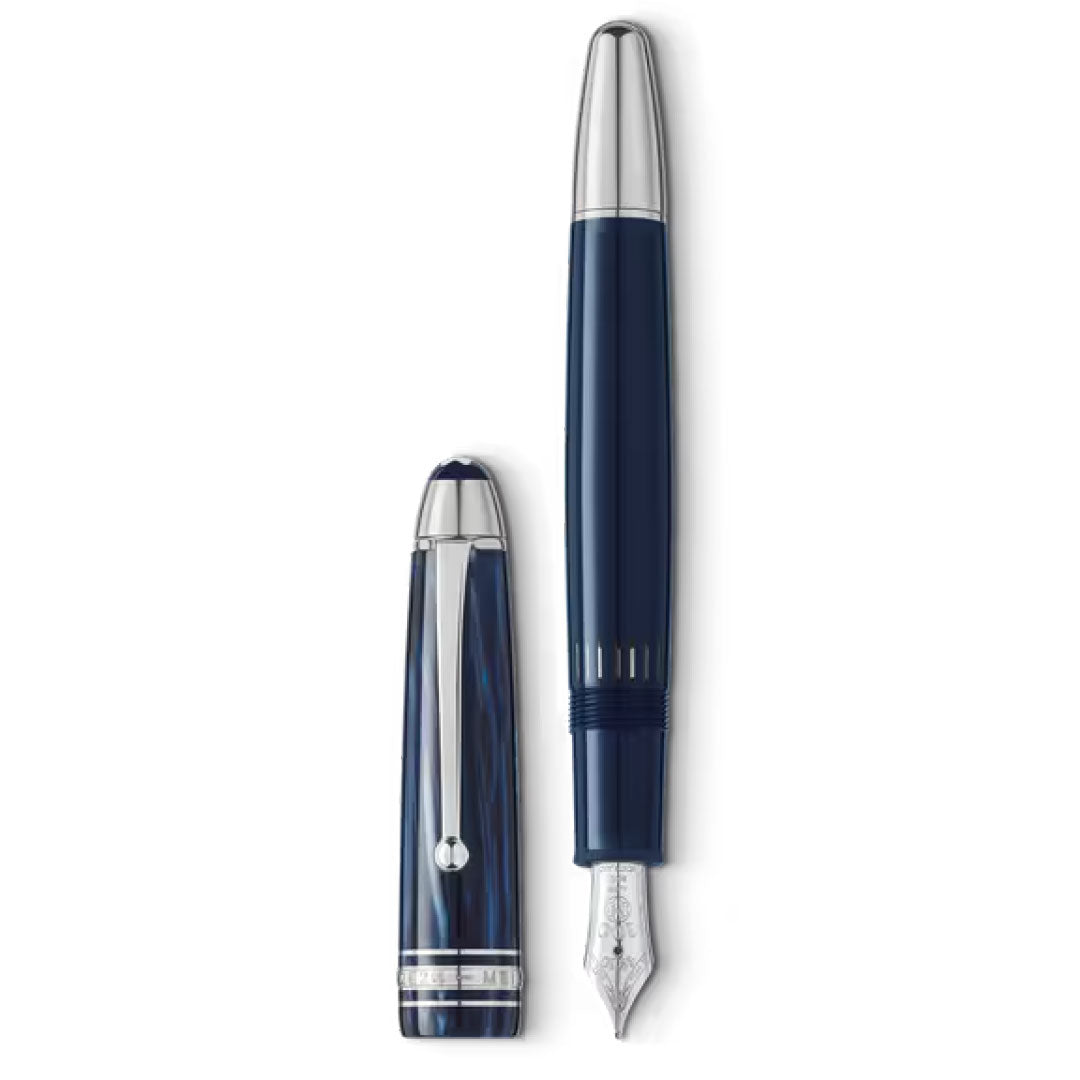 A Montblanc Meisterstück The Origin Collection Legrand Fountain Pen M is shown uncapped, revealing its silver nib and dark blue body with silver accents. The cap is placed beside this fine Montblanc writing instrument.