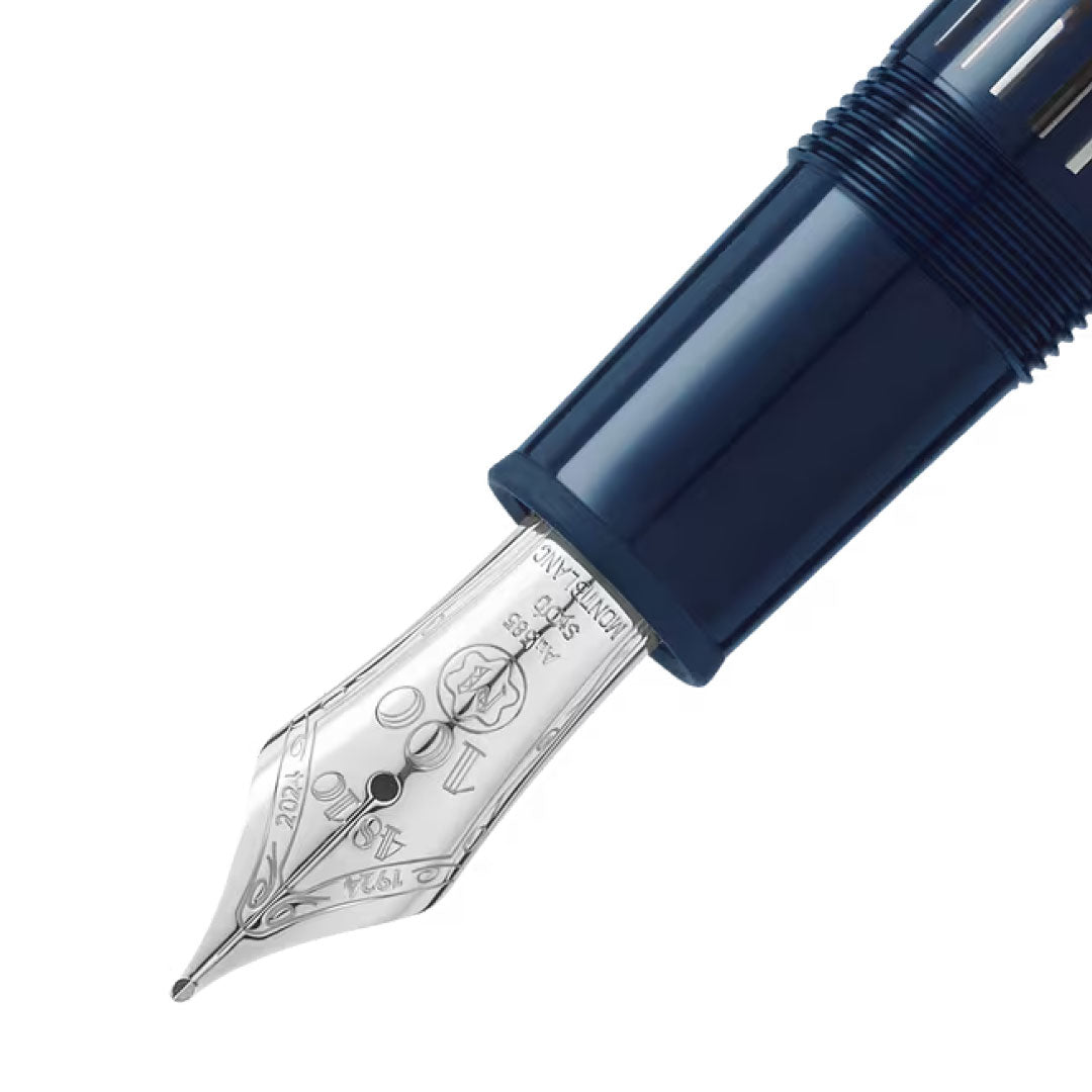 Close-up of the nib of a Montblanc Meisterstück The Origin Collection Legrand Fountain Pen M, a premium writing instrument with intricate engravings on its metallic tip, set against a white background.
