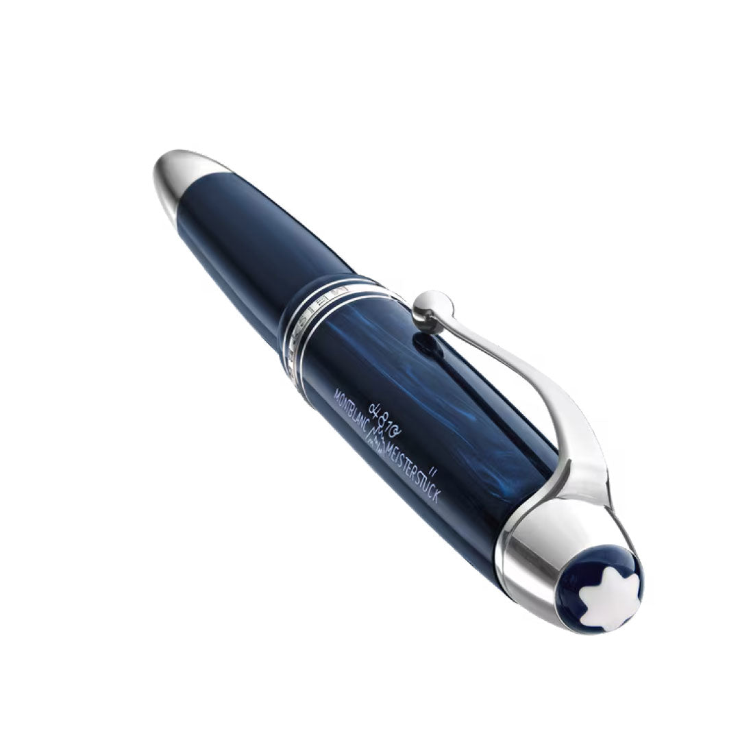 The Montblanc Meisterstuck The Origin Collection Legrand Fountain Pen M, a luxury navy blue fountain pen with silver accents and white star emblem, is shown diagonally against a white background—a premium writing instrument from Montblanc.