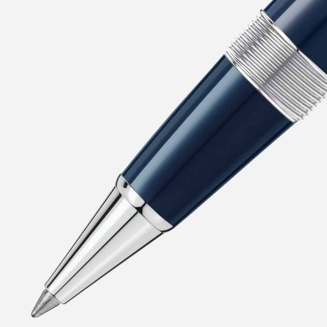 Close-up of a sleek Montblanc Meisterstück The Origin Collection Doue Le Grand Rollerball Pen, featuring blue with silver accents on the tip and ridged grip, set against a light gray background. A true fine writing instrument, reminiscent of the elegance found in Montblanc's renowned designs.