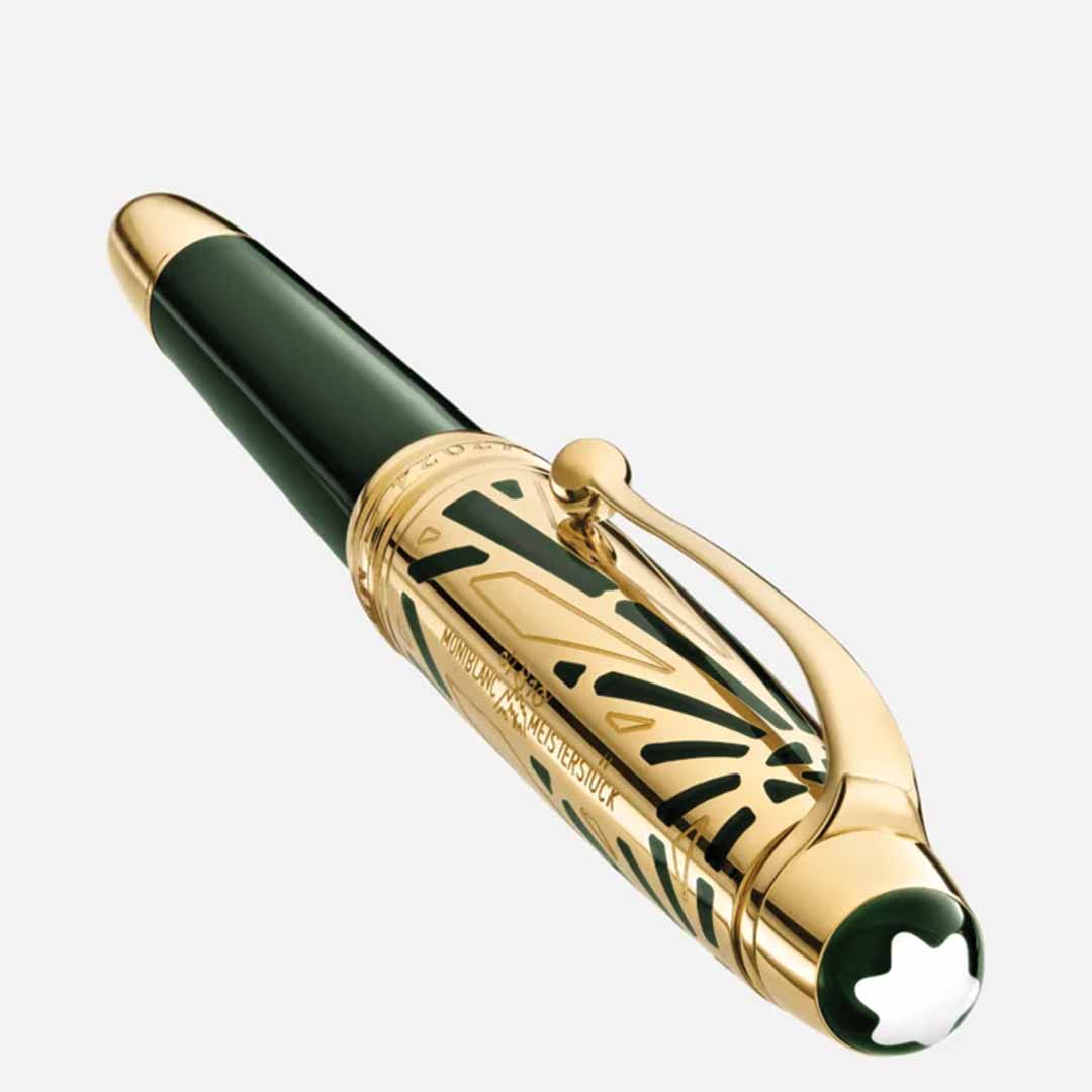 A luxurious rollerball pen from the Montblanc Meisterstuck The Origin Collection Doue Classique, featuring a dark green body and gold accents. It includes an intricate design near the clip and a star emblem on the cap, epitomizing excellence in fine writing instruments. The pen is elegantly displayed against a plain white background.