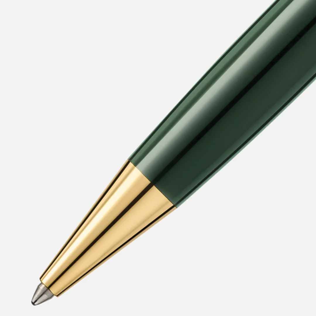 Close-up of the tip of a Montblanc Meisterstuck The Origin Collection Doue Classique Ballpoint Pen with a green body and gold accents, set against a plain white background.