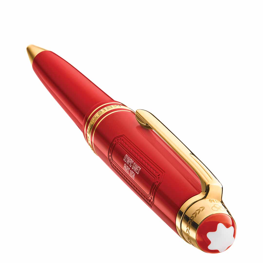 Presenting the elegant Montblanc Meisterstück X Olympic Heritage Paris 1924 Midsize Ballpoint Pen in red, complete with a gold clip and trim. The barrel is engraved for added sophistication, while the top features Montblanc’s iconic six-pointed star emblem, representing timeless elegance and craftsmanship.
