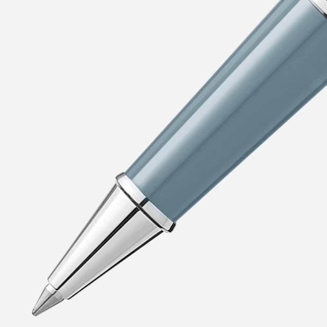 Close-up of the sophisticated Montblanc Meisterstück X Olympic Heritage Chamonix 1924 Classique Rollerball Pen, featuring a metallic tip and a glossy teal body, set against a simple background.