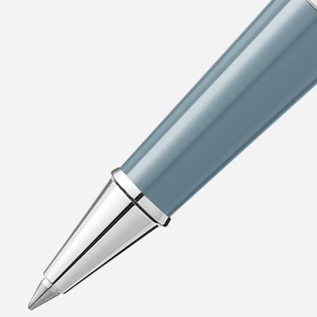 Close-up of a sleek blue and silver Montblanc Meisterstück X Olympic Heritage Chamonix 1924 Doue Classique rollerball pen against a plain background, highlighting the elegantly crafted tip and barrel—a true testament to timeless quality inherent in the Meisterstück collection.