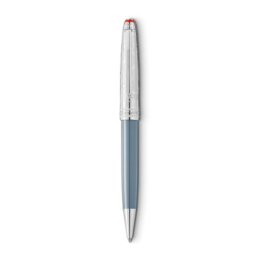 The Montblanc Meisterstück x Olympic Heritage Chamonix 1924 Doué Classique Ballpoint, a writing instrument with a silver barrel and light blue body, features a textured, transparent cap crowned with a striking red tip.