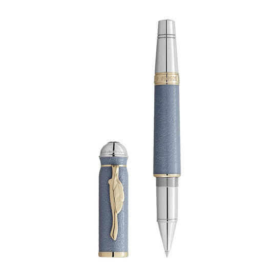 The Montblanc Writers Edition Homage to Johann Wolfgang von Goethe Limited Edition Rollerball Pen features a textured light blue barrel, gold accents, and a cap with a gold feather-shaped clip and silver detailing inspired by German literature.
