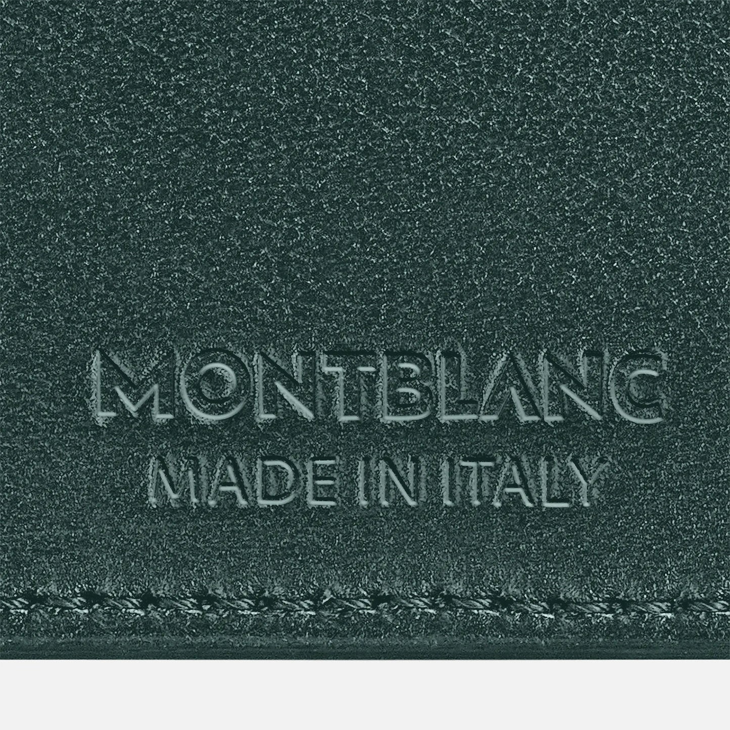 Close-up of a textured full-grain bovine leather surface in British Green, featuring embossed text reading "Montblanc Extreme3.0 Leather Card Holder 6cc" and "Made in Italy" below it.