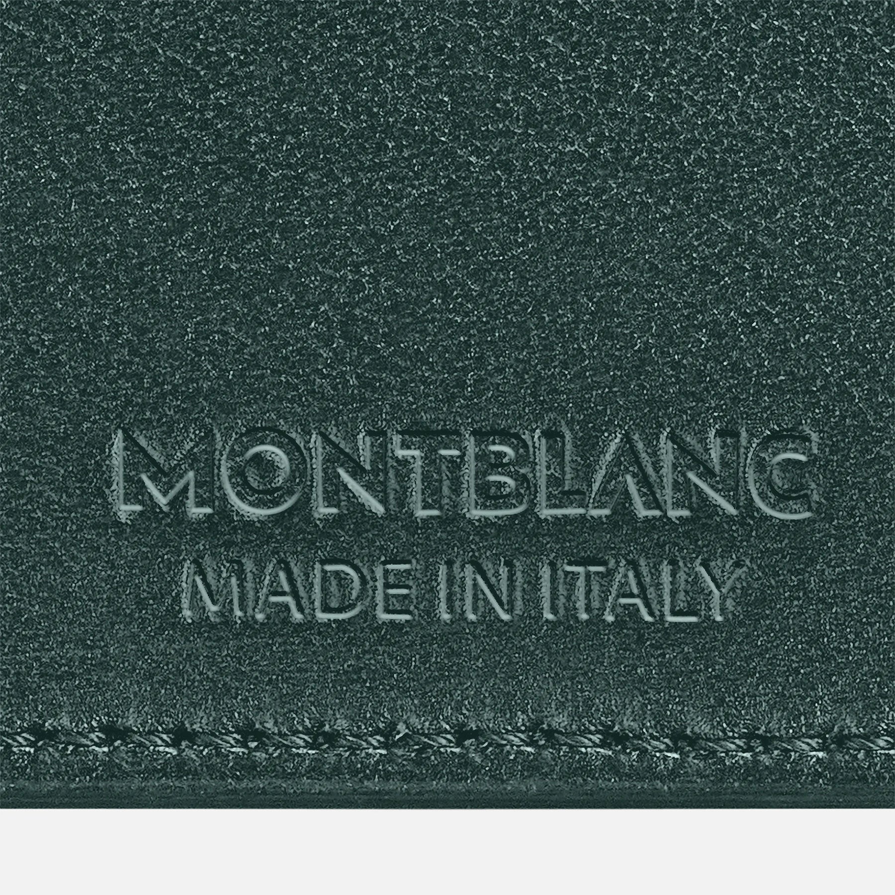 Close-up of a textured full-grain bovine leather surface in British Green, featuring embossed text reading "Montblanc Extreme3.0 Leather Card Holder 6cc" and "Made in Italy" below it.