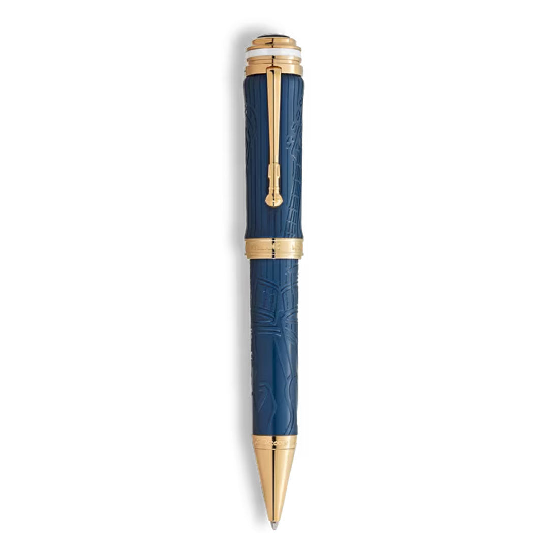 The Montblanc Great Characters Homage to Queen Special Edition Ballpoint Pen features a blue body with gold accents, engraved patterns, and a prominent gold clip by Montblanc, shown against a white background.