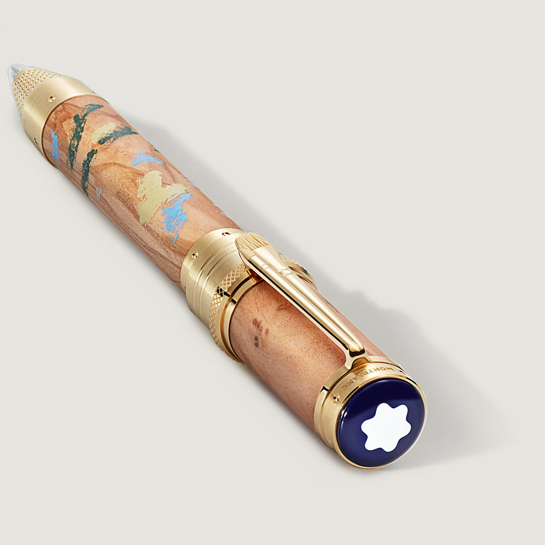 The Montblanc Masters of Art Homage to Pierre-Auguste Renoir Limited Edition 4810 Fountain Pen features a light brown marbled barrel, gold accents, vibrant markings, and a white star emblem on a navy blue cap end.