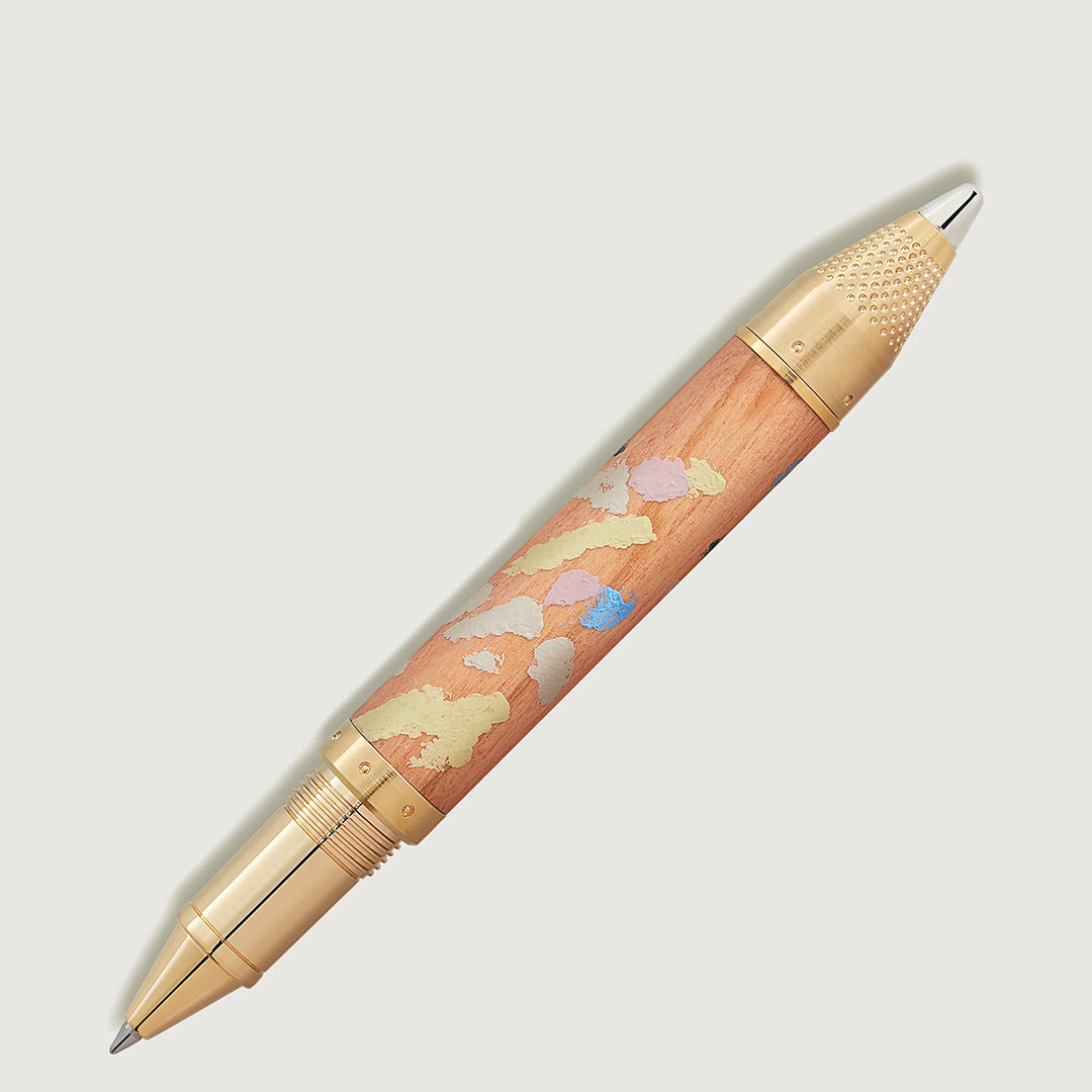 The Montblanc Masters of Art Homage to Pierre-Auguste Renoir Limited Edition 4810 Rollerball Pen features a luxurious gold and wood finish with cloud-shaped designs on the barrel, accented by metallic gold on the tip and cap, reflecting the elegance of Impressionism.