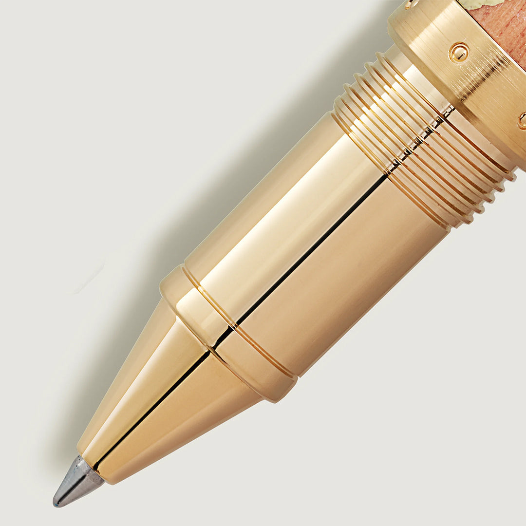 Close-up image of a gold-colored Montblanc Masters of Art Homage to Pierre-Auguste Renoir Limited Edition 4810 Rollerball Pen tip, its metallic finish shining against a plain background, showcasing the sleek, polished design that mirrors Renoir's refined Impressionism.