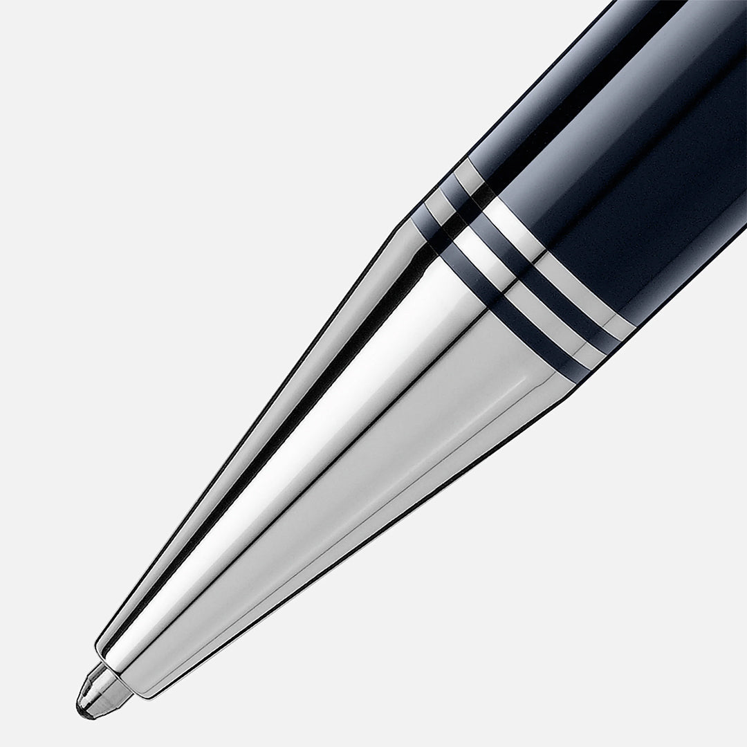 Close-up of the Montblanc John F Kennedy Special Edition Ballpoint Pen tip against a white background, highlighting its black and silver sleek, shiny metallic finish with a tapered design. The Montblanc emblem subtly enhances the pen's elegance.