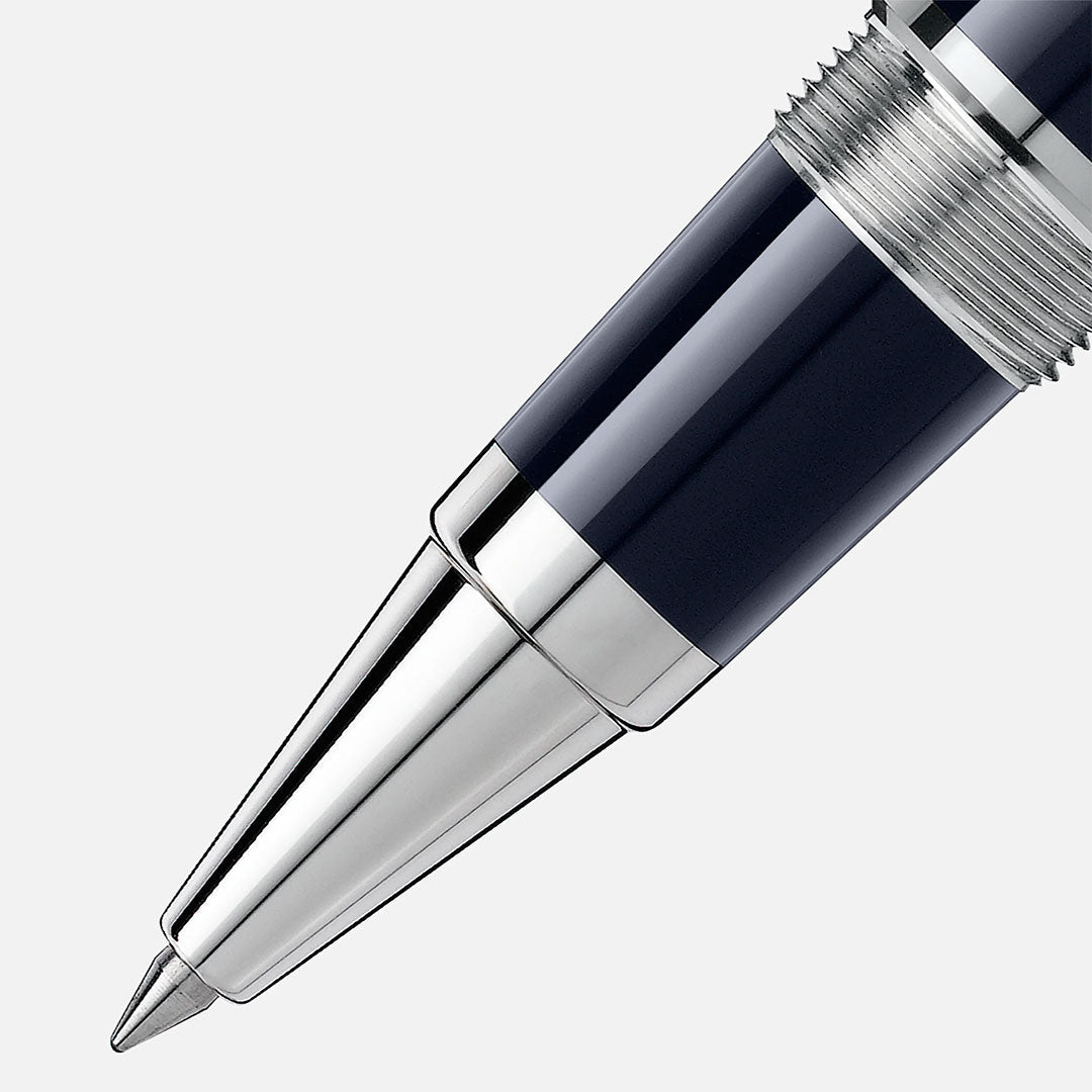 Close-up of the Montblanc John F. Kennedy Special Edition Rollerball Pen, featuring a shiny silver tip and dark blue barrel, set against a light gray background.