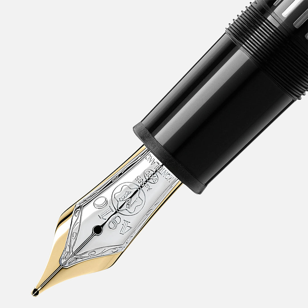 Close-up of a Montblanc Meisterstück Yellow Gold Coated 149 Fountain Pen nib with intricate gold and silver details, attached to a glossy black body, set against a plain white background.