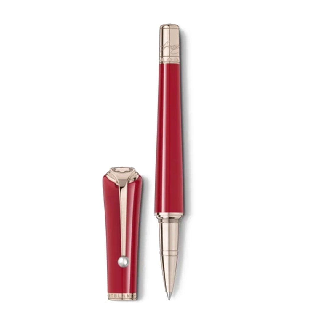 The Montblanc Muses Marilyn Monroe Special Edition Rollerball Pen is displayed with its matching cap. Sporting a sleek red design reminiscent of Ruby Tuesday lipstick, this pen stands vertically, featuring modern silver accents and a pearl-like detail on the cap against a plain white background.