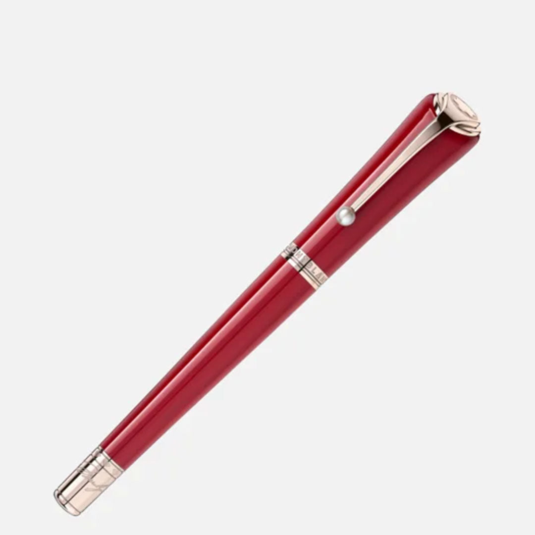 The Montblanc Muses Marilyn Monroe Special Edition Rollerball Pen, with its striking red reminiscent of Ruby Tuesday lipstick, features a glossy finish accented by silver details on the clip and ends, elegantly contrasted against a plain white background.