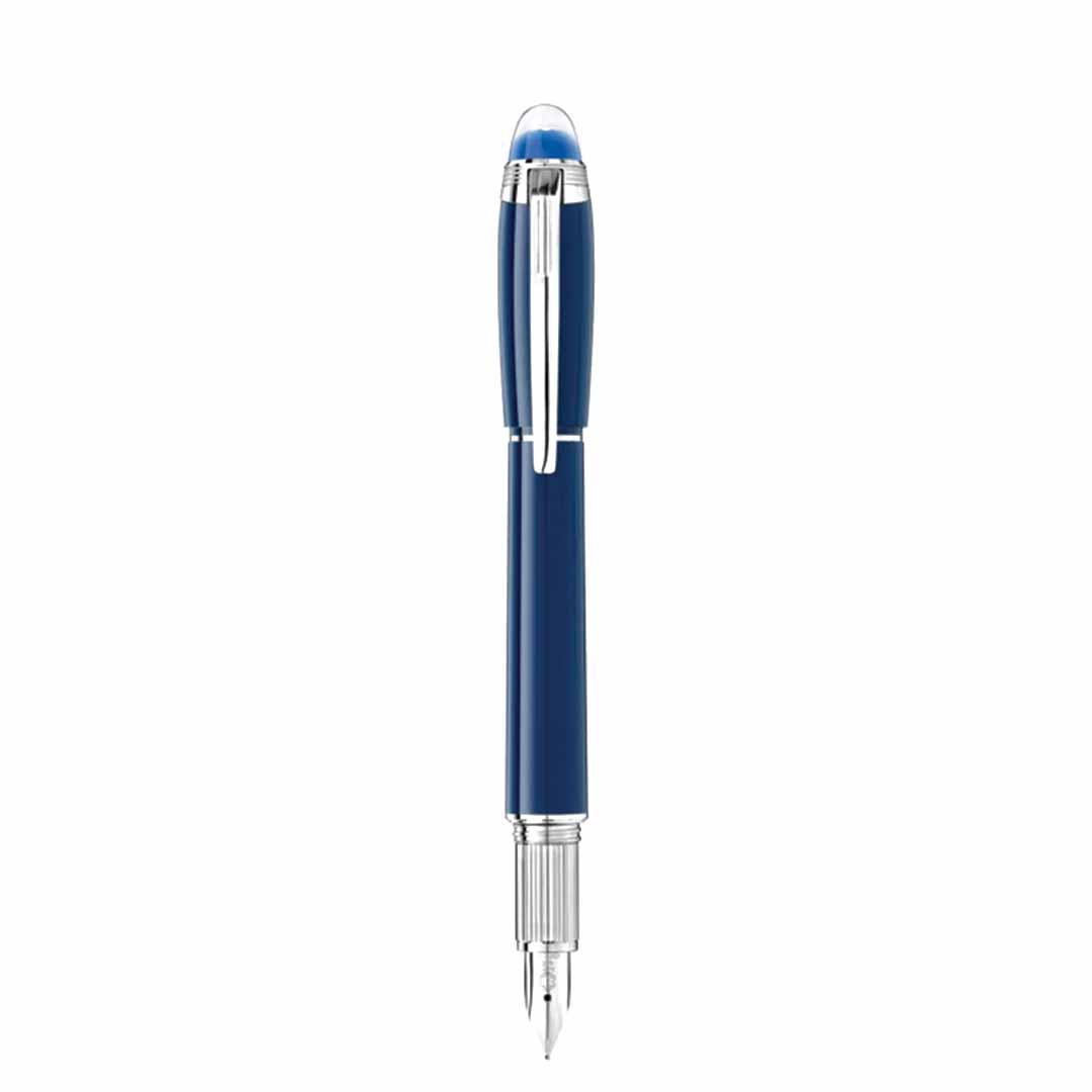 Standing upright against a white background, the Montblanc Starwalker Blue Planet Fountain Pen showcases a captivating blue and silver design, enhanced by its chrome clip and visible nib. This exquisite creation blends elegance with the adventurous spirit of space exploration.