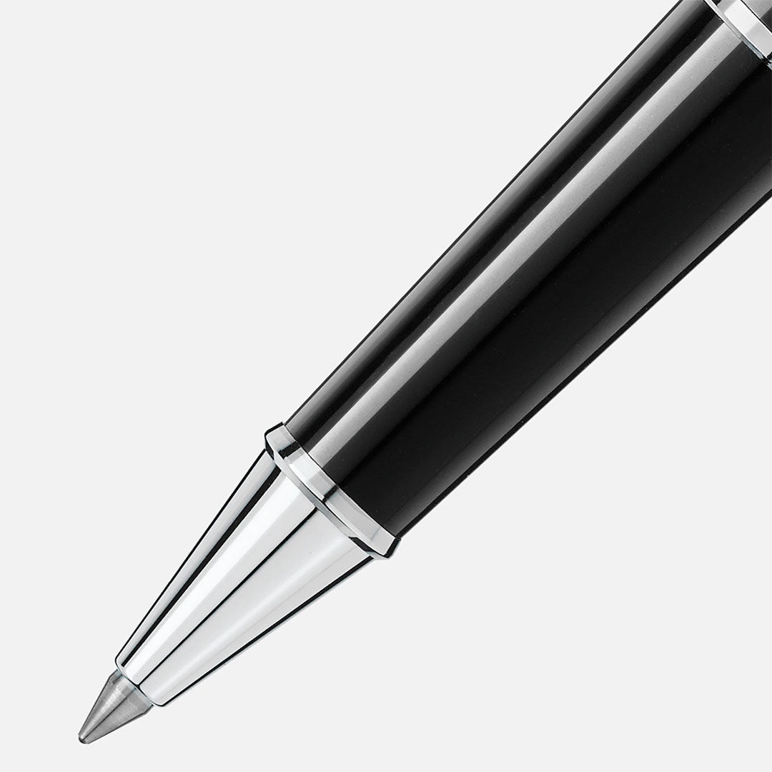 Close-up of the tip of a Montblanc Meisterstuck Platinum Coated Rollerball Pen, shown diagonally on a light gray background.