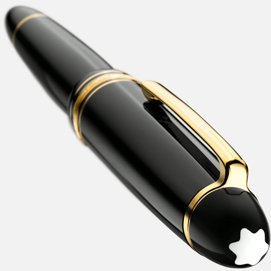 A close-up of the Montblanc Meisterstuck Yellow Gold Coated Legrand Rollerball Pen, featuring gold accents and the iconic white emblem on its cap, set against a light background.