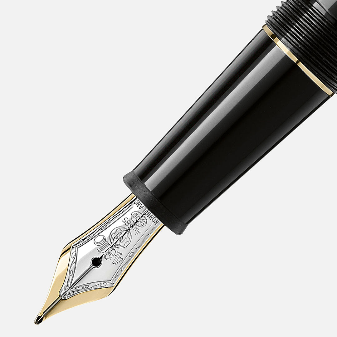 Close-up of the Montblanc Meisterstuck Yellow Gold Coated Fountain Pen, featuring a shiny gold-plated nib with detailed engravings, set against a plain white background.