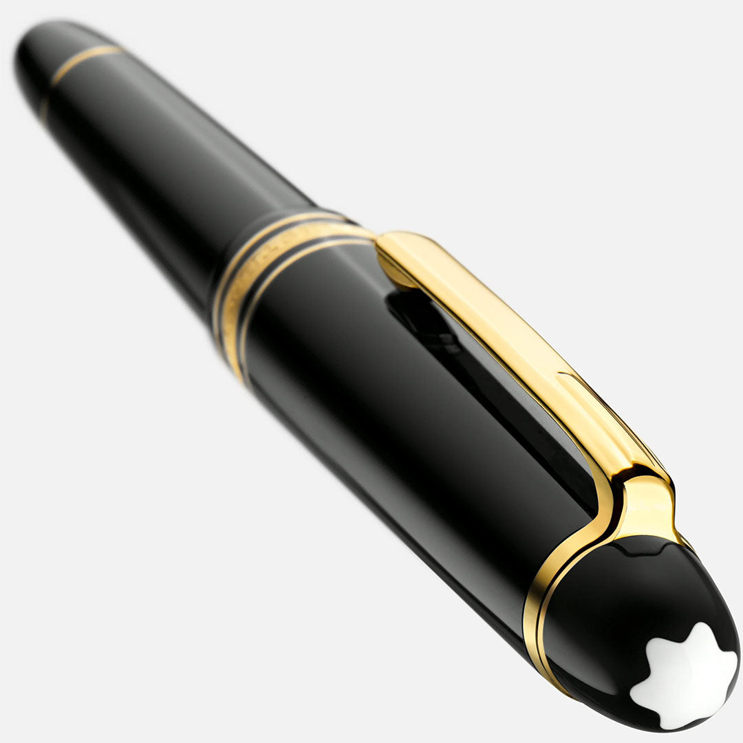 A close-up of the Montblanc Meisterstuck Yellow Gold Coated Fountain Pen, featuring gold accents and the signature white star emblem on its cap, set against a light background.