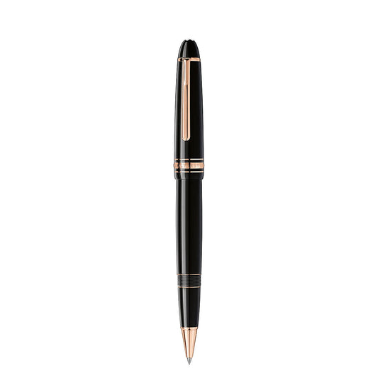 The Montblanc Meisterstuck Rose Gold Coated Legrand Rollerball Pen, with elegant rose gold accents on the clip, band, and tip, stands vertically against a white background.