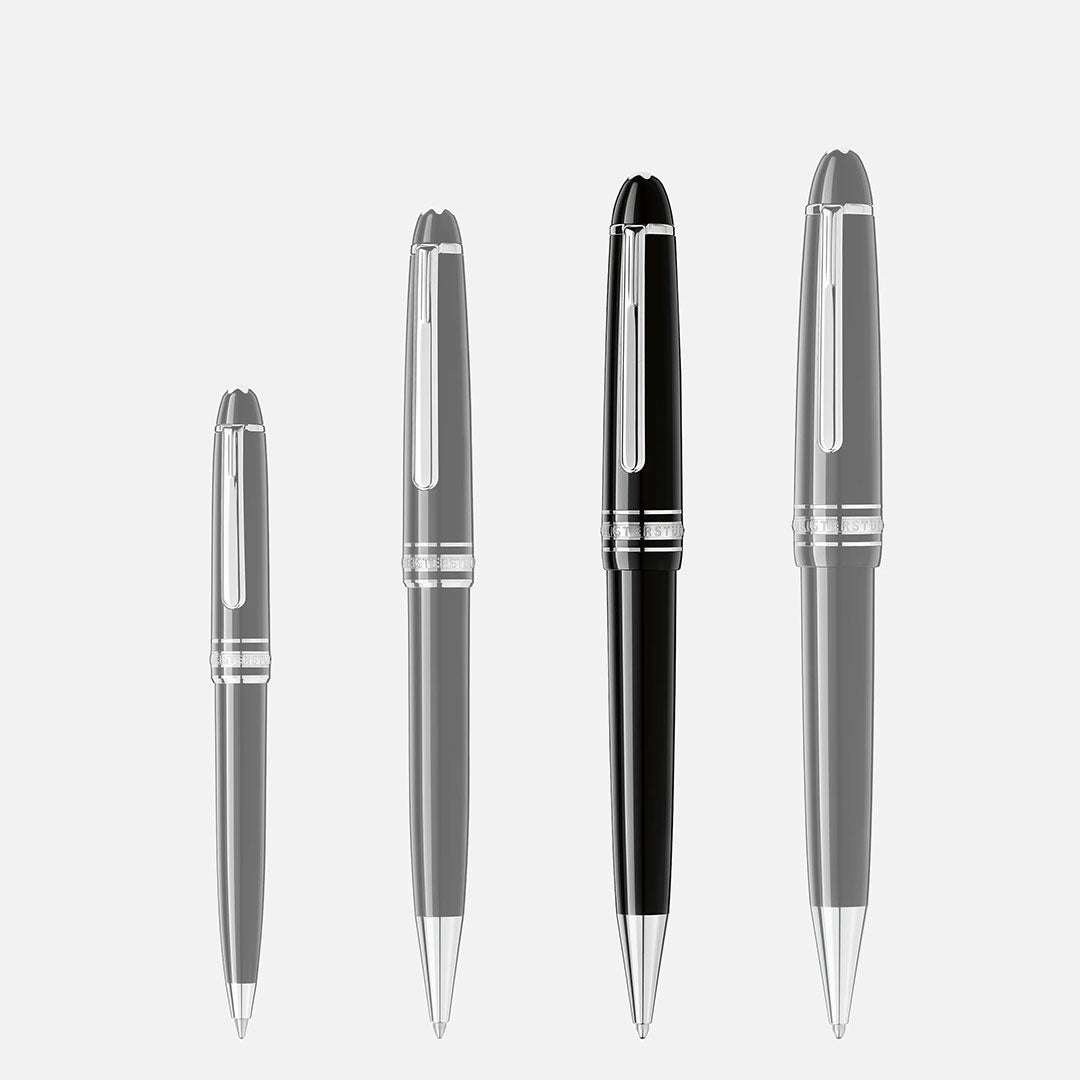 Four ballpoint pens are lined up on a white background. The rightmost and largest pen is the Montblanc Meisterstuck Platinum Coated Midsize Ballpoint Pen, featuring black precious resin with silver accents in the classic Montblanc style.