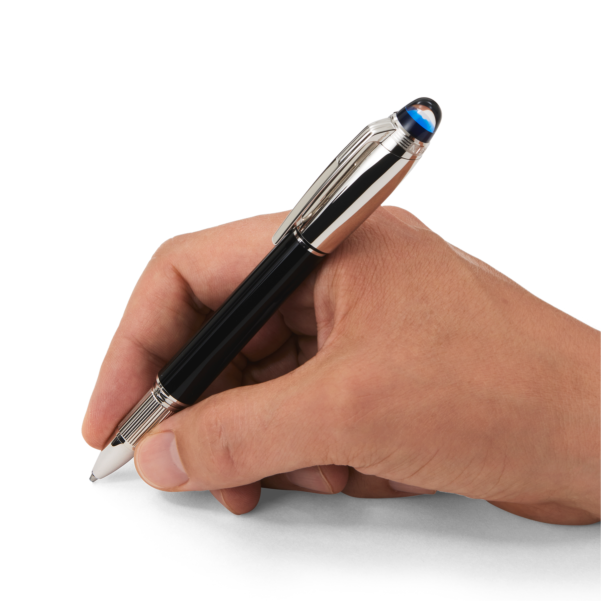 A hand holding a Montblanc StarWalker Doué Fineliner Pen, featuring black casing with silver accents and a translucent blue Montblanc emblem dome at the top of the cap.