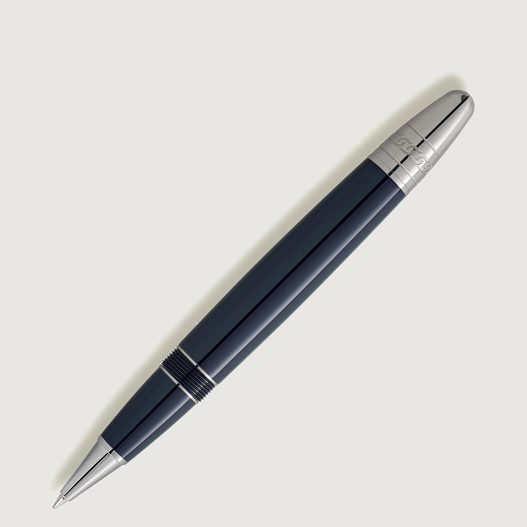 The Montblanc Meisterstuck Around the World in 80 Days Legrand Rollerball Pen is a sleek dark blue precious resin pen with a silver tip and clip, set against a light grey background. It features an engraved decorative silver band, capturing the elegance of its namesake adventure.