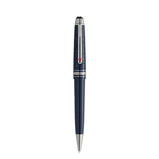 The Montblanc Meisterstück Around the World in 80 Days midsize ballpoint pen exudes adventure with its sleek dark blue body, silver accents, red arrow clip, intricate cap pattern, and shiny metallic tip.