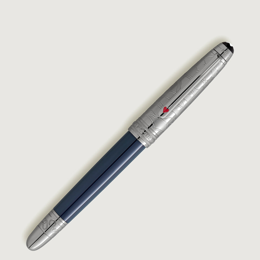The Montblanc Meisterstück Around the World in 80 Days Doue Classique Rollerball Pen showcases a sleek blue barrel and silver cap with engravings inspired by Jules Verne's novel, highlighted by a small red emblem, positioned diagonally on a light gray background.